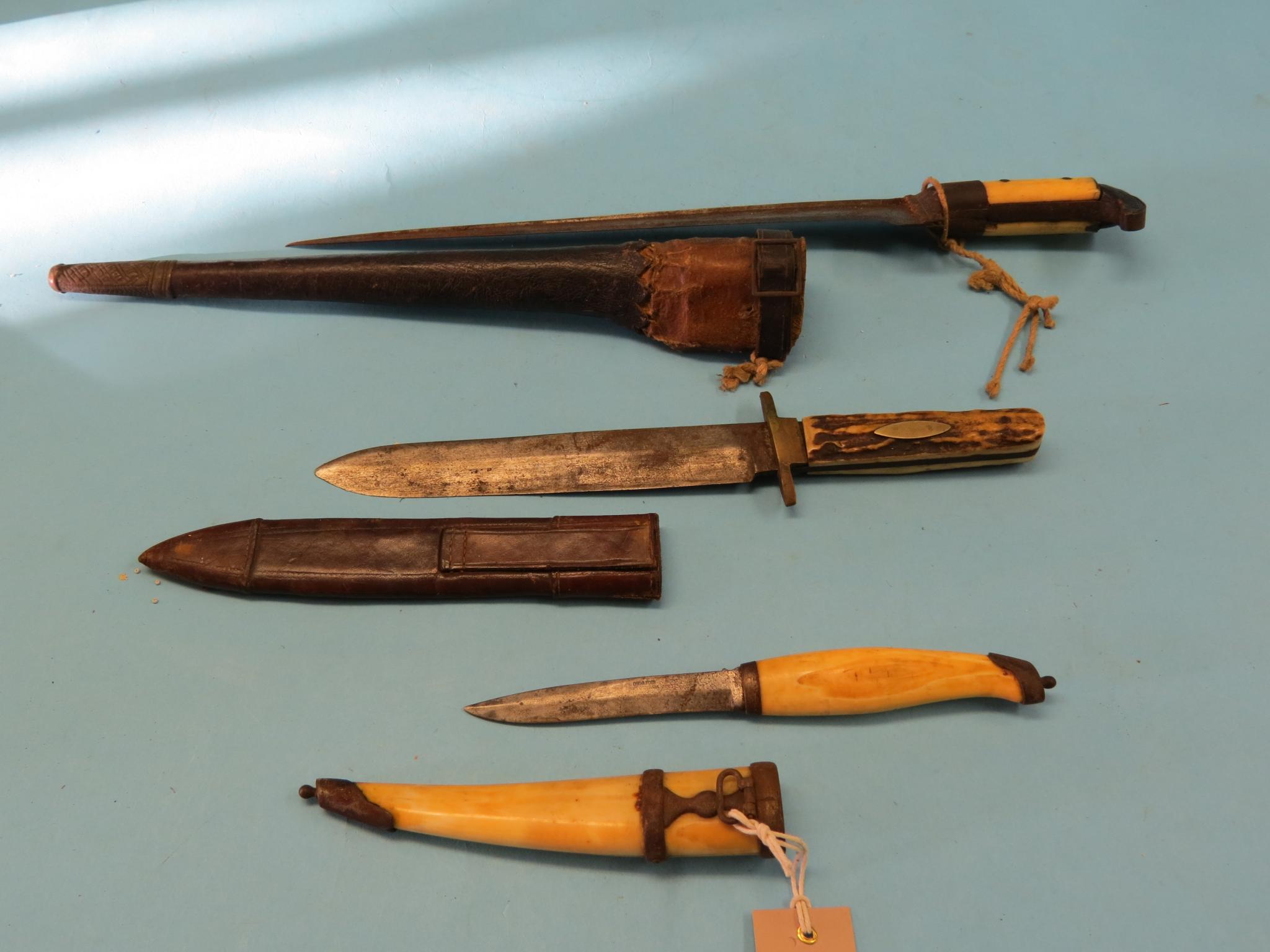 A bone-handled dagger, within metal-mounted bone sheath, 11in. and two other daggers, each within