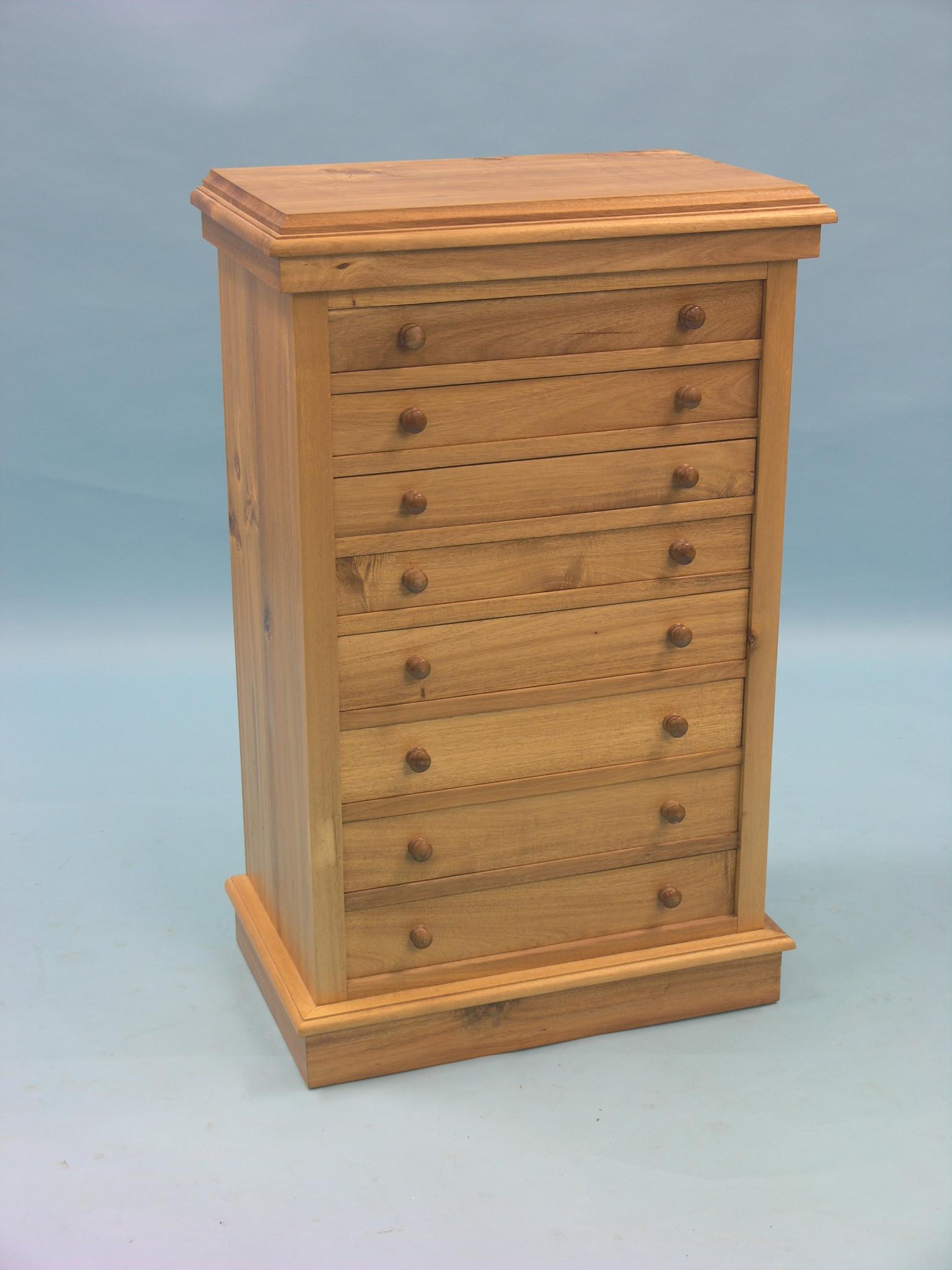 A Victorian-style hardwood Wellington chest, eight graduated drawers, 1ft. 10in.