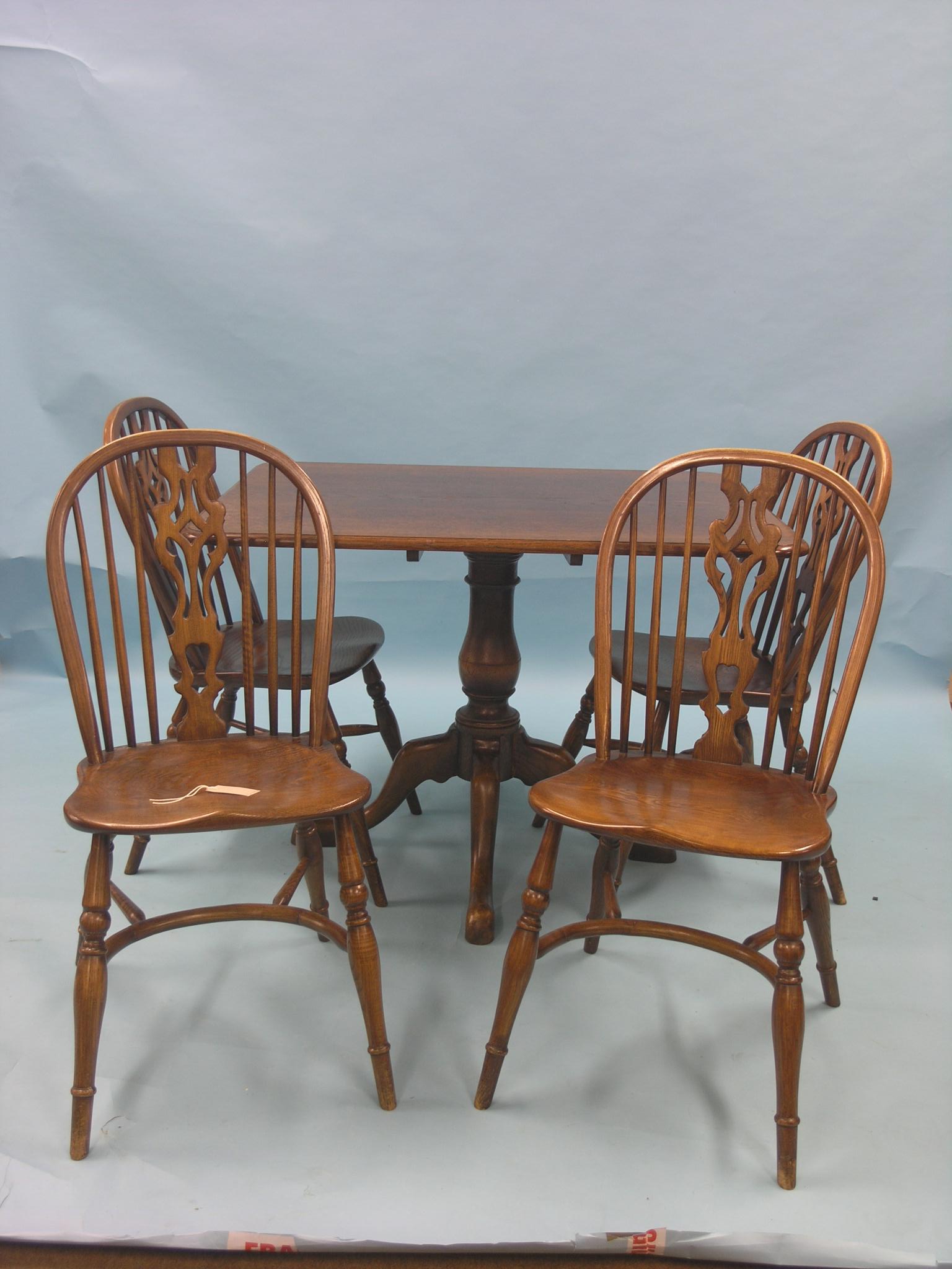 A Georgian-style oak breakfast table, rectangular top on pedestal base, top 3ft. 6in. x 2ft. 9in.