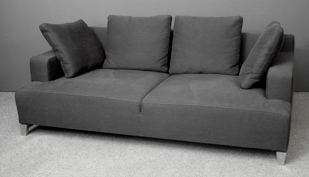 A modern Lignet Roset two seat square back settee upholstered in dark grey cloth, on aluminium