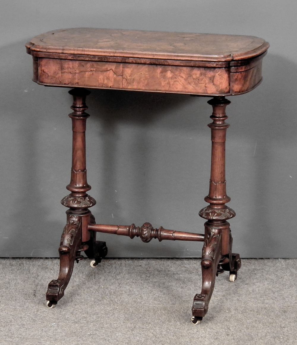 A Victorian figured walnut rectangular games table with bowed ends, the folding top enclosing chess,