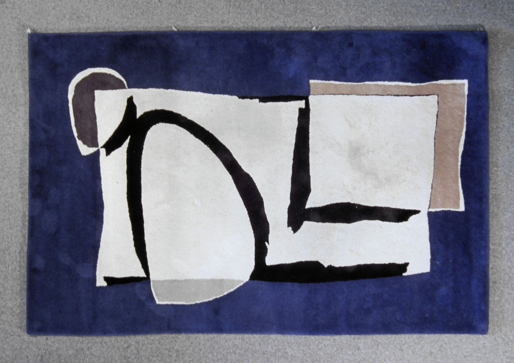 A modern “Arc” rug designed by Helen Yardley in blue, black, off-white and grey, 9ft ins x 6ft