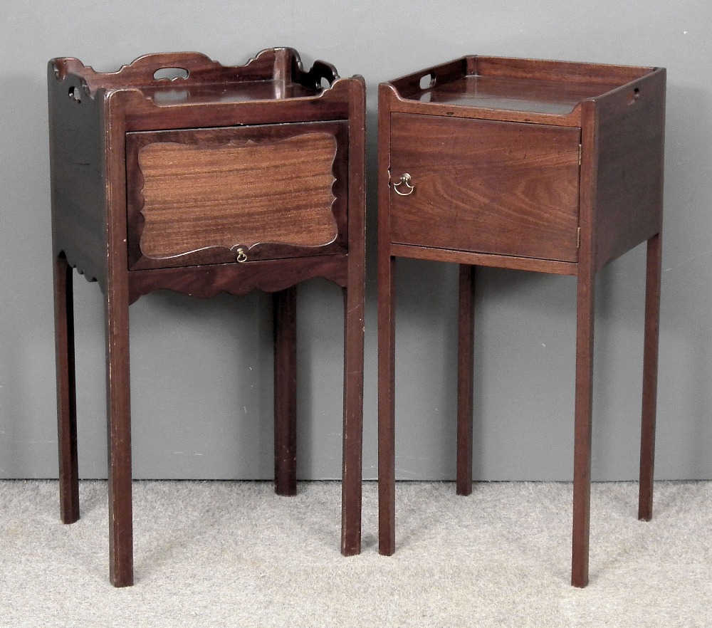 A George III mahogany tray top bedside cupboard with three handle cut-outs to sides, enclosed by