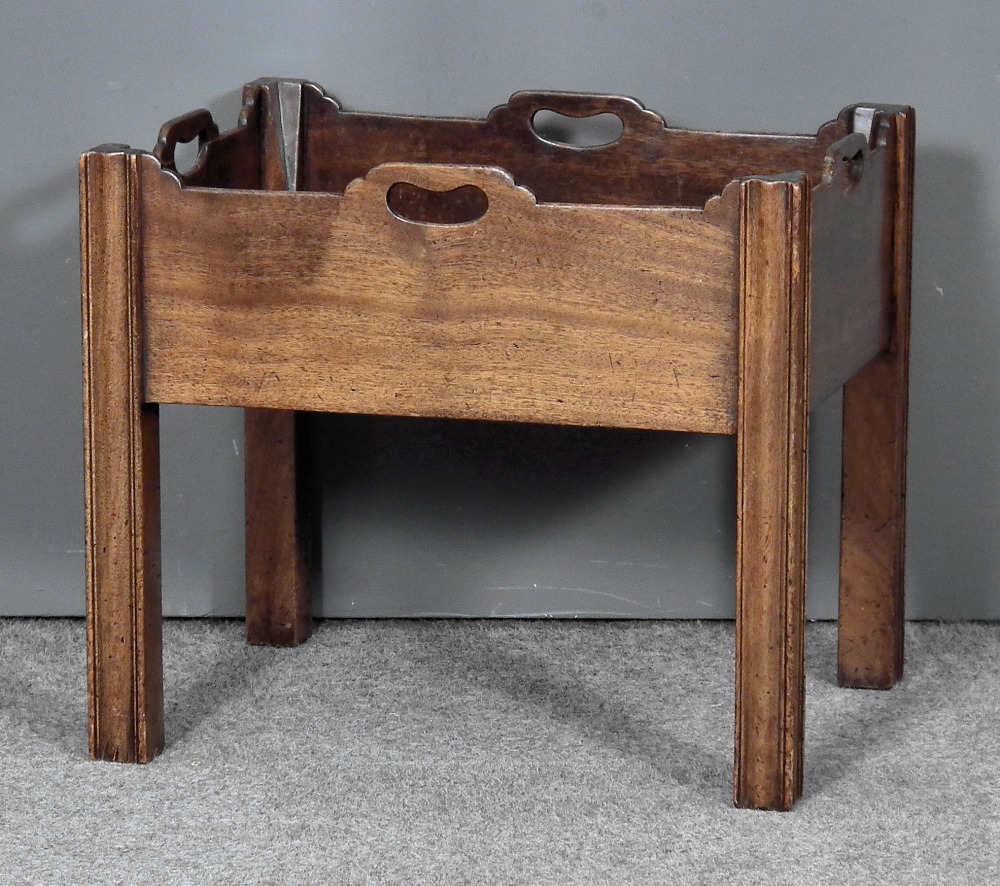 A mahogany rectangular bottle stand of Georgian design with handle cut-outs to sides, on square