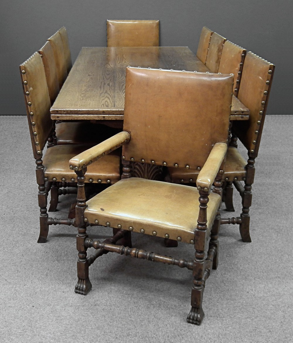 A set of ten oak high back armchairs of Cromwellian design, the square backs, seats and arm pads