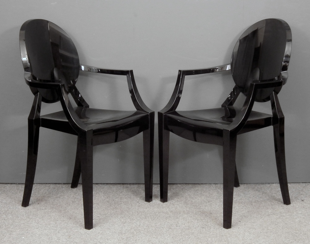 A pair of modern black carbonate ‘Louis Ghost’ armchairs by Kartell, designed Phillipe Starck: