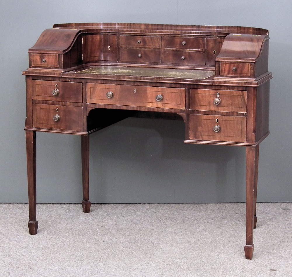 A modern mahogany "Carlton House" desk, the superstructure fitted six small drawers and cupboards,