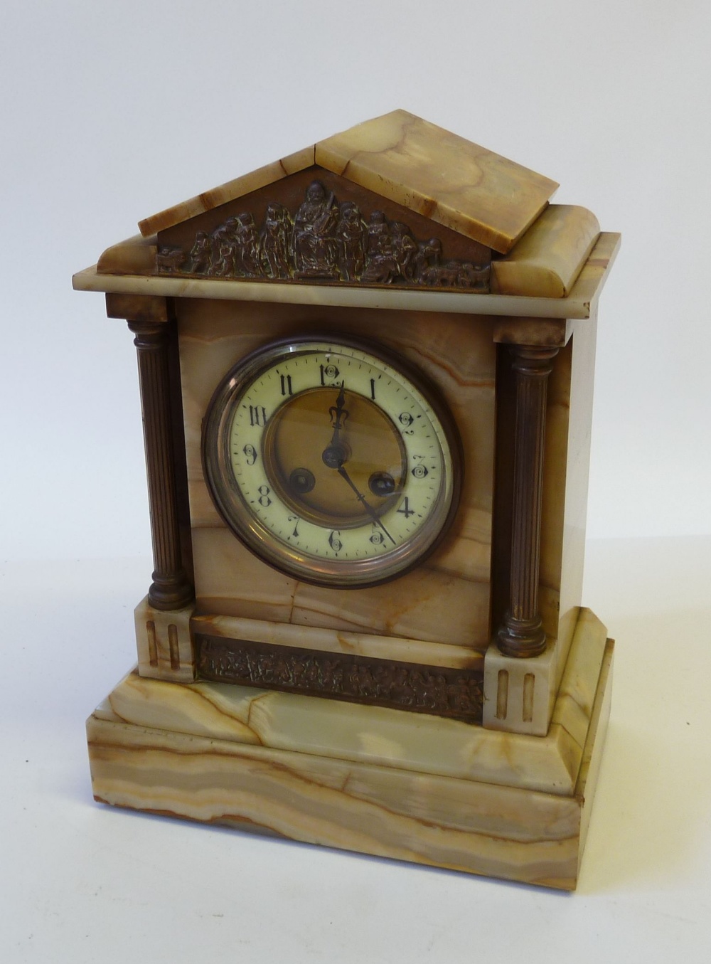 LATE NINETEENTH CENTURY ONLY CASED MANTEL CLOCK, with copper plaquettes and pillars flanking the