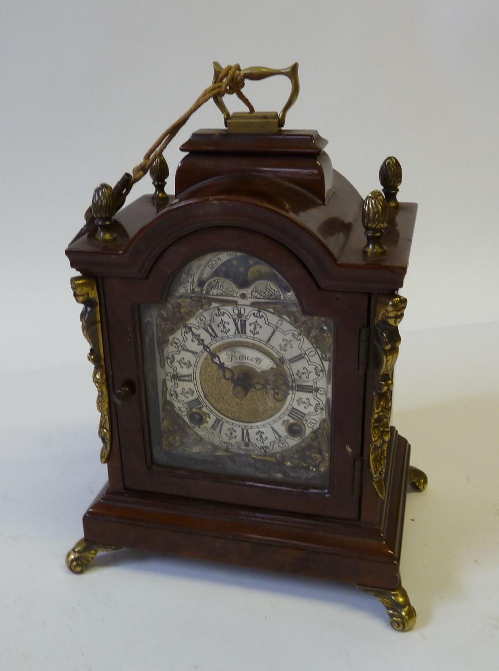 A TWENTIETH CENTURY, GEORGIAN STYLE SIMULATED FIGURED WALNUT SMALL MANTLE CLOCK, the 3 ½" (8.9cm)