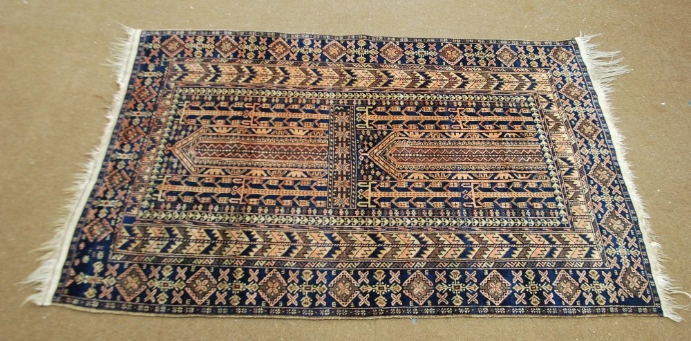 AFGHAN TURKOMAN ERSARI TRIBAL RUG, with unusual double mihrab panels in browns on a black field,