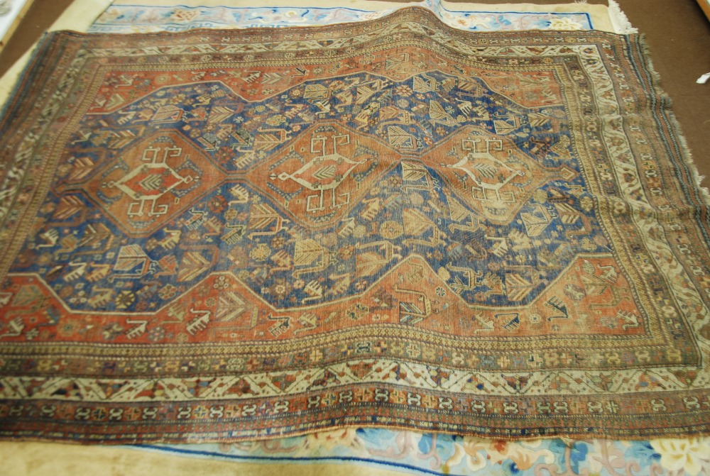 SEMI ANTIQUE SHIRAZ PERSIAN CARPET, with red triple pole medallion and wavy side panels on a blue