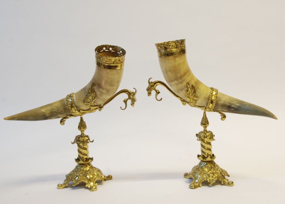 PAIR OF GILT METAL MOUNTED HORNS ON STANDS, each with pierced collar and pedestal stand with