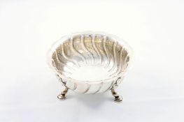 A Victorian circular silver bowl, hallmarked London 1894, of spiral fluted design and supported on