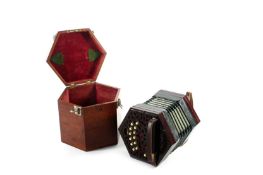 A Victorian Silber & Fleming concertina, of rosewood construction with ivory keys and pierced fret-