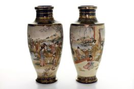 A large pair of Japanese Export Satsuma vases, early 20th century, decorated with panels depicting