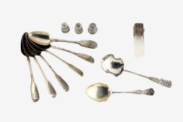 A small collection of seven silver teaspoons one plated spoon, three thimbles and a silver topped