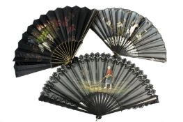 Three black 19th century lace fans, the first with painted scene depicting a lady in a farming scene