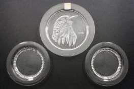 A collection of four Lalique glass plates, comprising: a 1973 Lalique Crystal bird plate in original