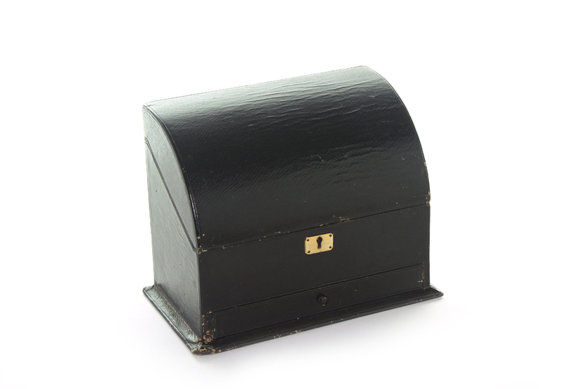 An Asprey black leather stationery box, with curved top hinged lid, fitted interior and drawer