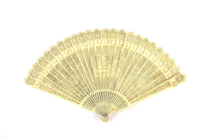A very finely carved and pierced ivory fan Chinese, early 19th century, the ivory sticks pierced