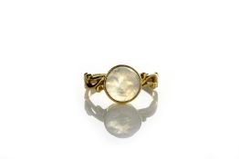 A 19th century ring set with moonstone intaglio of a face, size ‘K’