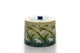 A Dennis China Works ‘Snowdrop’ pattern biscuit barrel, designed by Sally Tuffin, of cylindrical