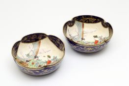 A matched pair of Japanese Satsuma dishes, circa 1900, of lobed circular form, painted with panels