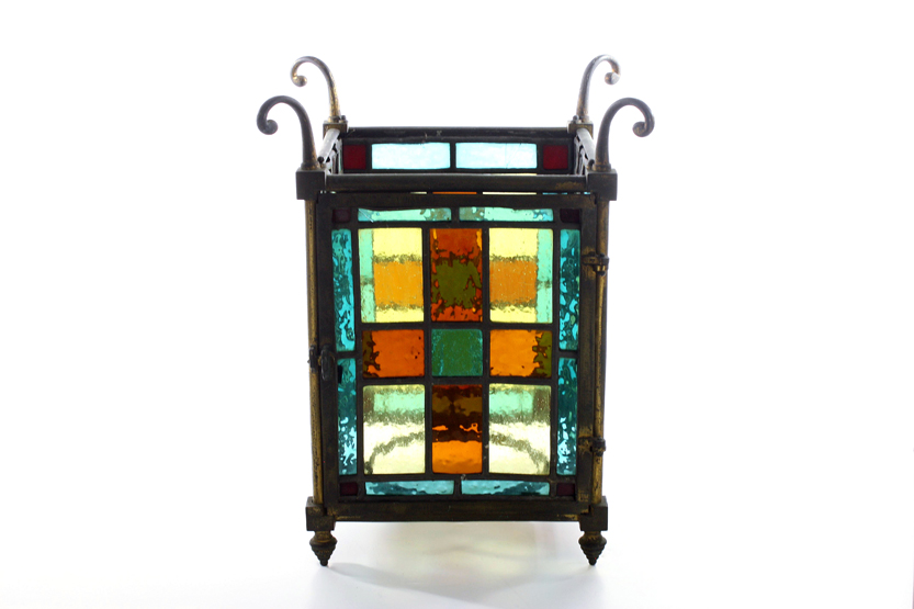 A 1920s stained glass porch light, of rectangular form with hooks for hanging chains, approximate