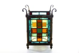 A 1920s stained glass porch light, of rectangular form with hooks for hanging chains, approximate