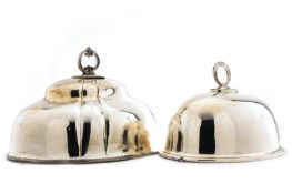 Two silver plated meat domes, the larger of segmented form with acanthus handles, the smaller with
