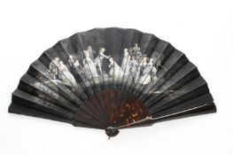 An early 20th century French black silk and tortoiseshell hand painted fan, painted with a night