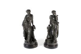 A pair of Victorian classical spelter figures, well modelled as robed women resting against