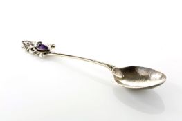 An Arts & Craft silver teaspoon by Sybil Dunlop hallmarked London 1914/1915, initialled on the