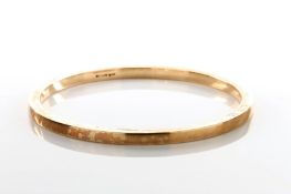 A 9ct gold slave bangle, engraved LVB, (10g), diameter 9.5cm