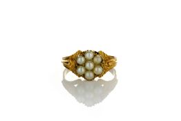 An early 19th century split pearl cluster ring, in chased setting, ‘M ½’