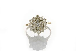 An 18ct gold diamond cluster ring set with 19 diamonds in claw setting, ‘R’