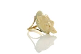 A carved ivory foxes head ring, on split shank, ‘W’