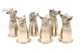 An unusual cased set of six silver plated animal head stirrup cups by Gucci, depicting a stag, two
