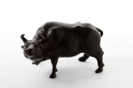 A Meiji period Japanese bronze buffalo, modelled in a realistic pose with head raised. Engraved