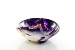 A Derbyshire Blue John shallow bowl, early 19th century, of good colour, supported on a small