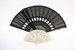 Two sequinned late Victorian fans, the larger with black guard sticks and sequinned material, the