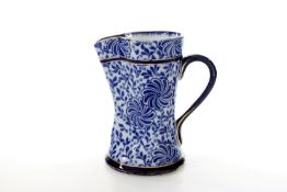 A Doulton Burslem water jug, with blue and white floral transfer printed decoration and gilt rim,