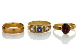 An 18ct gold single stone ring set with faceted garnet, in split shank setting, together with a