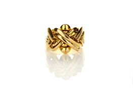 A gentleman’s gold coloured metal puzzle ring, Continental, comprising of eight sections to form a