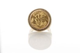 A gentleman’s 18ct gold signet ring set with full sovereign, hallmarked 1913, on decorative shank,