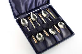 A set of six Art Deco style silver and enamel coffee spoons, hallmarked Birmingham 1956, in a fitted