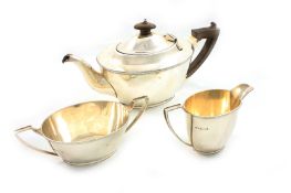 A George V Mappin & Webb three piece silver tea set, hallmarked Sheffield 1923, of plain tapered
