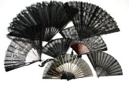 Two small black Victorian fans, with fine cotton and sequins, one of the fans with wooden guard