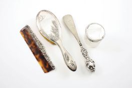 A collection of mixed silver dressing table items, comprising a silver backed Birmingham hair brush,