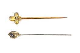 A gilt metal paper knife, with three faceted citrines to top and stylised ribbon below, together